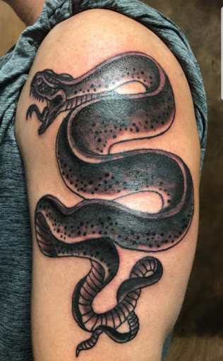 Explore anime hand tattoo ideas, creative tattoo ideas in Murfreesboro, available at Middle Tennessee Tattoo Co.