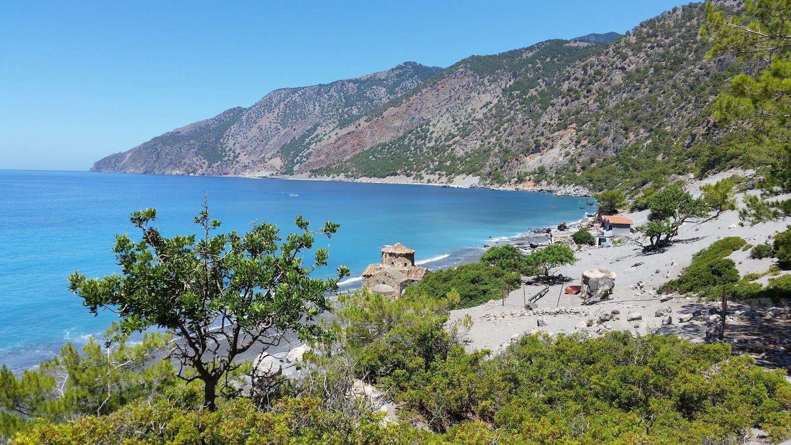 Foto av Agios Pavlos beach med grå sten yta