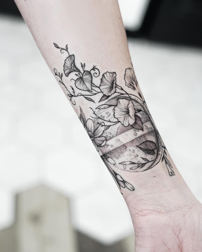 Explore halloween sleeve tattoo ideas, creative tattoo ideas in Logan, available at The White Wasp Tattoo Studio