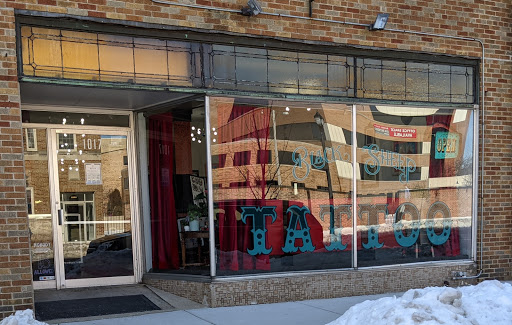 Explore boxing gloves tattoo ideas, creative tattoo ideas in South Milwaukee, available at Black sheep tattoo studio