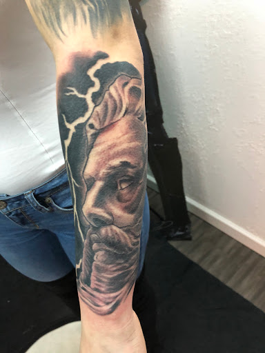 Explore arm sleeve tattoo ideas for guys, creative tattoo ideas in Kansas City, available at Waldos Darkside Tattoo