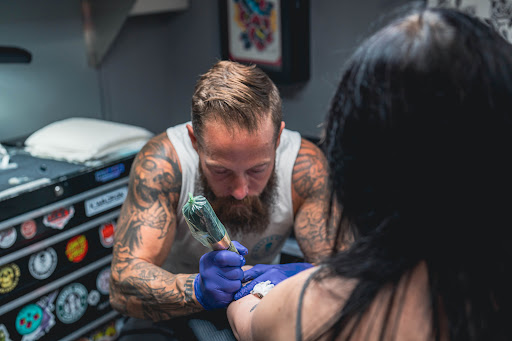 Explore tattoo ideas for men leg, creative tattoo ideas in Charleston, available at The Edge Tattoo Studio