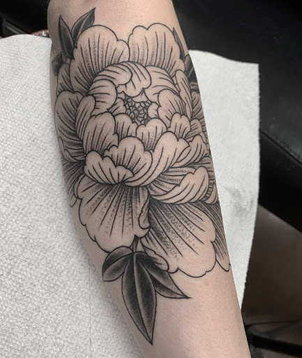 Explore skull and rose tattoo ideas, creative tattoo ideas in Edgewood, available at Wild Coyote Tattoo