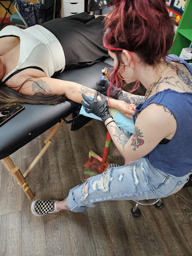 Find harley quinn and poison ivy tattoo ideas for your next unique tattoo in Metairie at Galactic Tattoo Studio