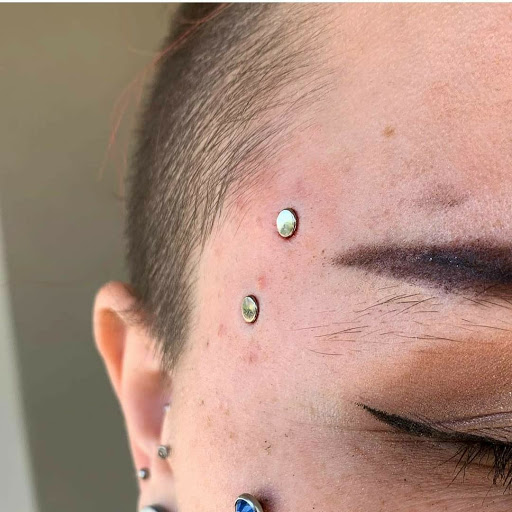 Explore womens chest tattoo ideas, creative tattoo ideas in Summerville, available at Exotic Impressions Body Piercing