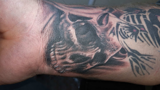 Explore big tattoo ideas female, creative tattoo ideas in Angola, available at Hoodlum Ink