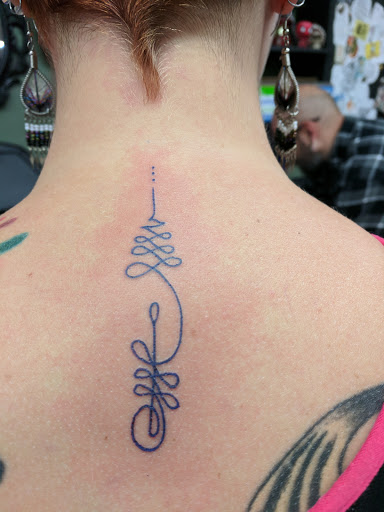Explore rainbow tattoo ideas, creative tattoo ideas in Coeur D Alene, available at Jojos Tattoo & Body Piercing