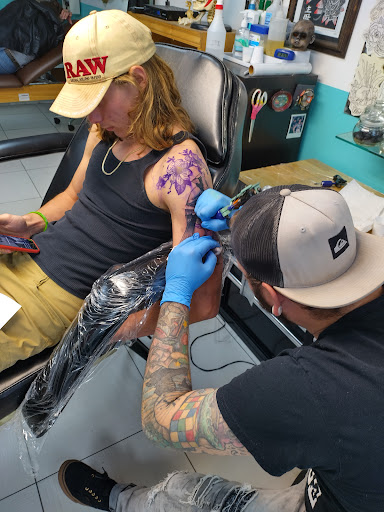 Explore script tattoo ideas for guys, creative tattoo ideas in Saint Petersburg, available at Edens Apple Tattoos and Piercings