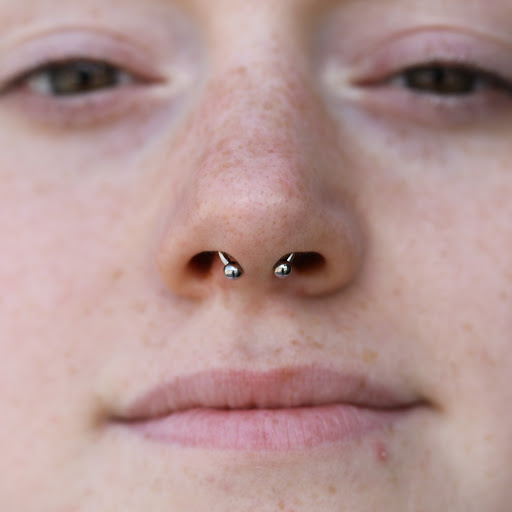 Explore red string of fate tattoo ideas, creative tattoo ideas in Charleston, available at MOLA Piercing and Fine Jewelry