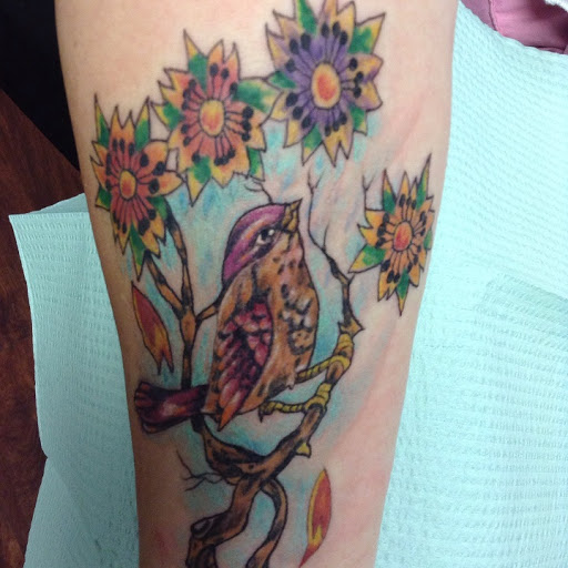 Explore thigh tattoo ideas for women, creative tattoo ideas in Seymour, available at American Gypsy Tattoo Corp.