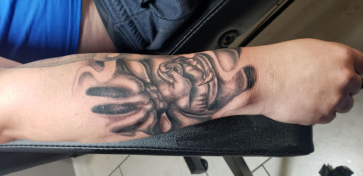 Explore tattoo ideas for men hand, creative tattoo ideas in Ocoee, available at Slaughterized Ink Tattoo and Piercing Studio