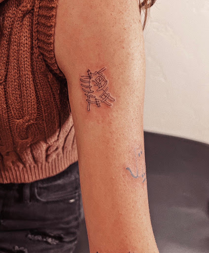 Explore graduation tattoo ideas, creative tattoo ideas in Burley, available at Fine Line Ink