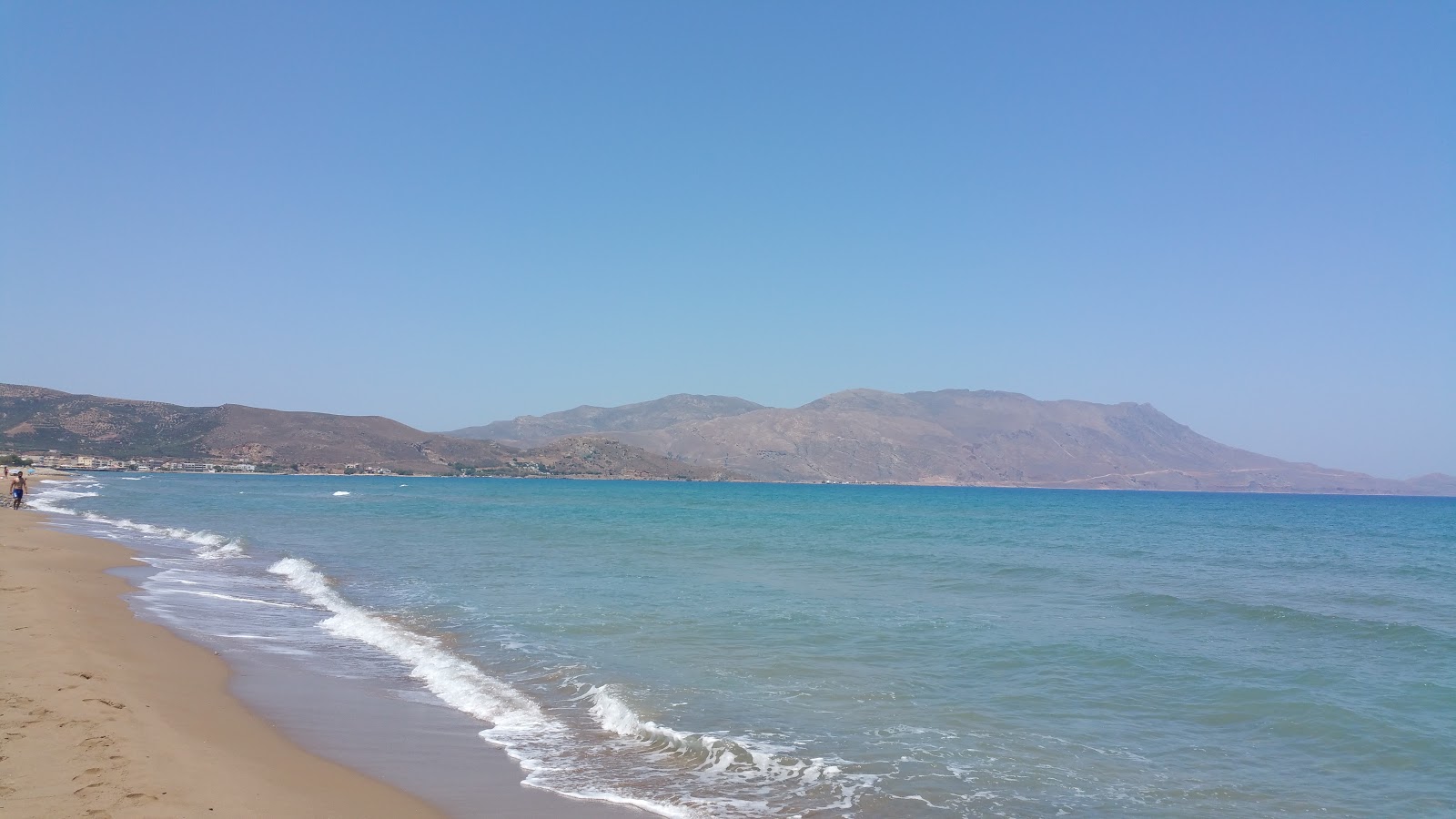 Photo de Livadia Beach avec sable lumineux de surface