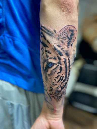 Explore lower back tattoo ideas, creative tattoo ideas in Keyport, available at Taboo Tattoos