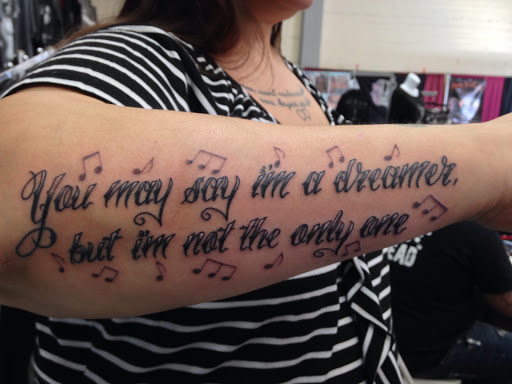 Explore ribbon tattoo ideas, creative tattoo ideas in Sacramento, available at 13 MAG TATTOO