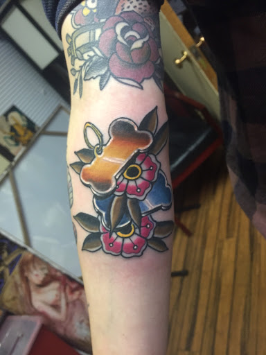 Explore cute behind the ear tattoo ideas, creative tattoo ideas in Green Bay, available at Skinny Buddha Tattoo