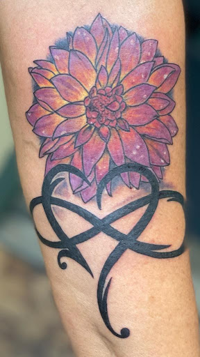 Explore spinal cord tattoo ideas, creative tattoo ideas in Romulus, available at Urban Rituals Piercing and Tattoo