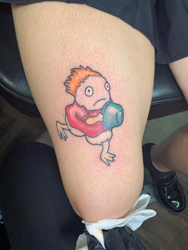 Explore red hand tattoo ideas, creative tattoo ideas in Williamston, available at Inkd Tattoo Parlor