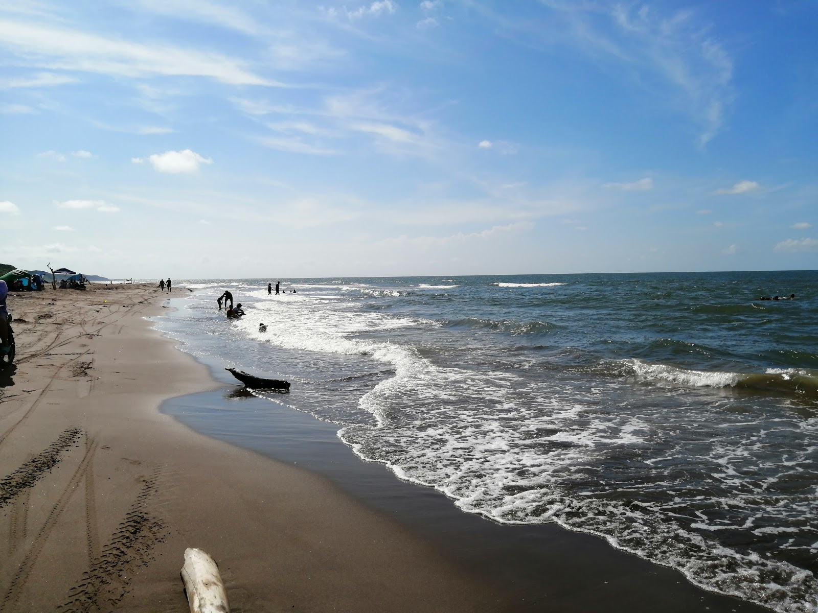 Foto di Playa de Alvarado con una superficie del sabbia grigia