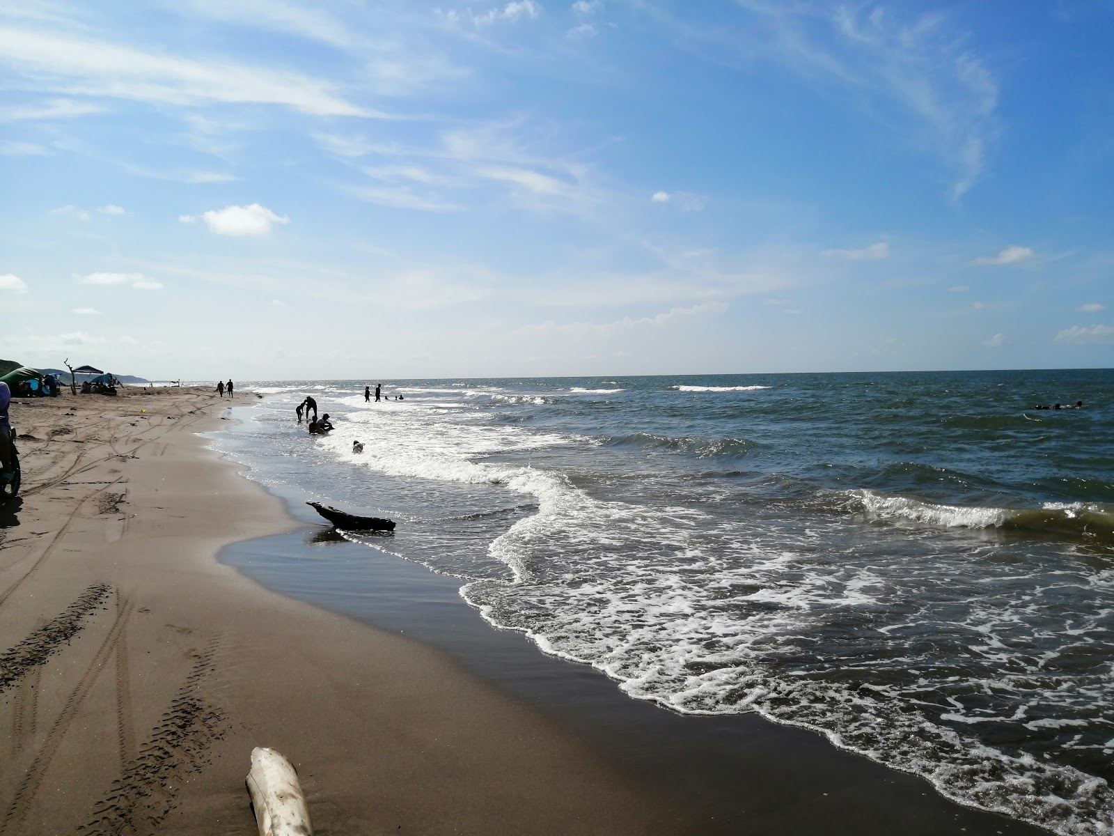 Playa de Alvarado的照片 带有灰沙表面