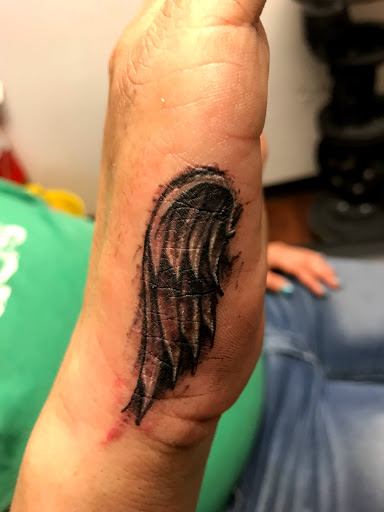 Explore fish tattoo ideas for females, creative tattoo ideas in Seymour, available at American Gypsy Tattoo Corp.