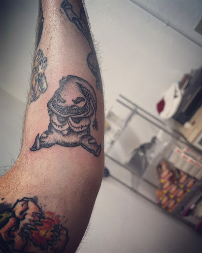 Explore traditional hand tattoo ideas, creative tattoo ideas in Cocoa, available at Rorschach Tattoo Shop and Piercing Studio