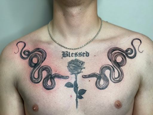 Explore mic tattoo ideas, creative tattoo ideas in Huxley, available at Lonely Bones Tattoo & Art