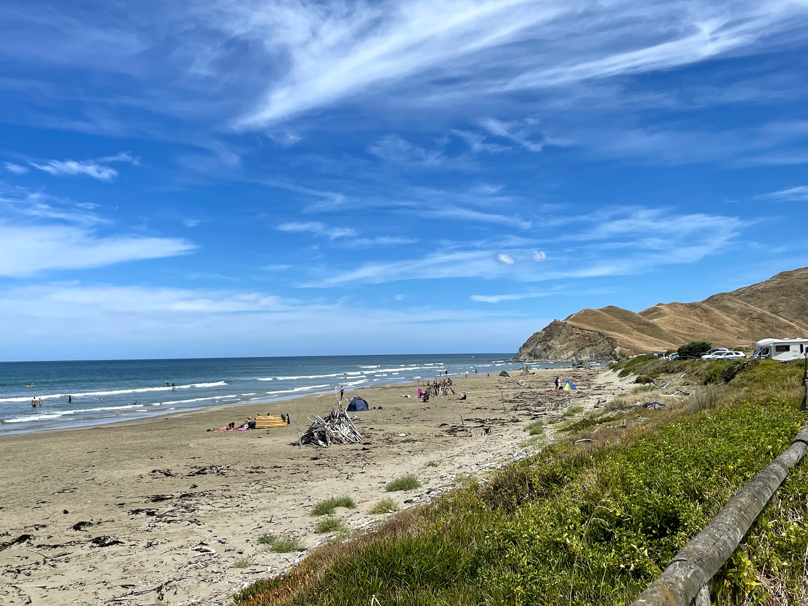 Photo of Kairakau Beach backed by cliffs