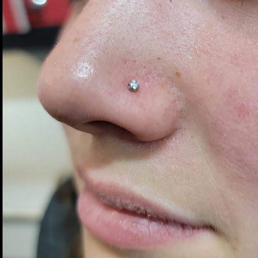 Explore brown pride tattoo ideas, creative tattoo ideas in Washington, available at Trilogy Atelier - DC Tattoo Shop Piercing Studio