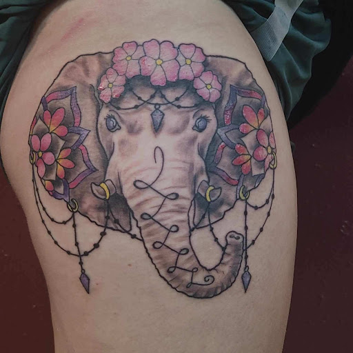 Explore thigh tattoo ideas men, creative tattoo ideas in Rogers, available at Tailored Fit Tattoo and Gallery