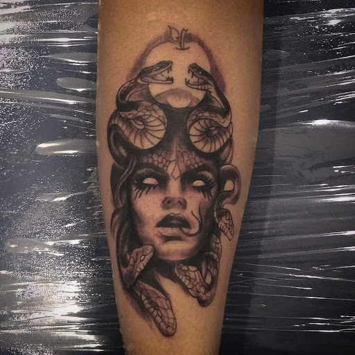 Explore flower spine tattoo ideas, creative tattoo ideas in Mobile, available at Boujie Tattoo & Body Piercing