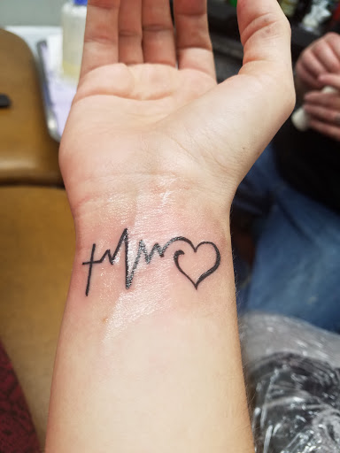 Tattoo Shop «Almighty Tattoo ( Under new ownership now Loyalty Tattoo Company!!!!)», reviews and photos, 5337 S Dort Hwy, Flint, MI 48507, USA