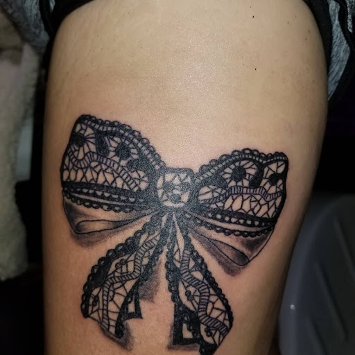 Explore cover up tattoo ideas for women, creative tattoo ideas in Onalaska, available at Divine Designs tattoo studio