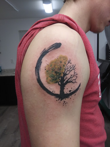 Explore mountain biking tattoo ideas, creative tattoo ideas in Lufkin, available at Blue Lotus Tattoo & Piercing