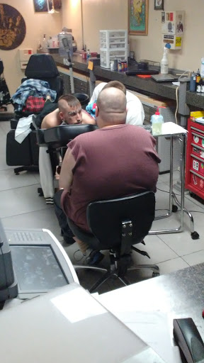 Tattoo Shop «13 Daggers Tattoo Studio», reviews and photos, 2130 Fort Campbell Blvd suite c, Clarksville, TN 37042, USA