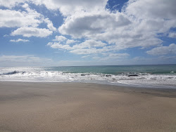 Photo de Playa Juan Gomez entouré de montagnes