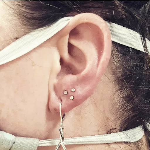 Explore cute flower tattoo ideas, creative tattoo ideas in North Charleston, available at Exotic Impressions Body Piercing