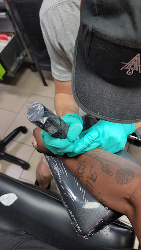 Explore tattoo cover up ideas for words, creative tattoo ideas in Sarasota, available at SEVEN SINS Tattoo Studio