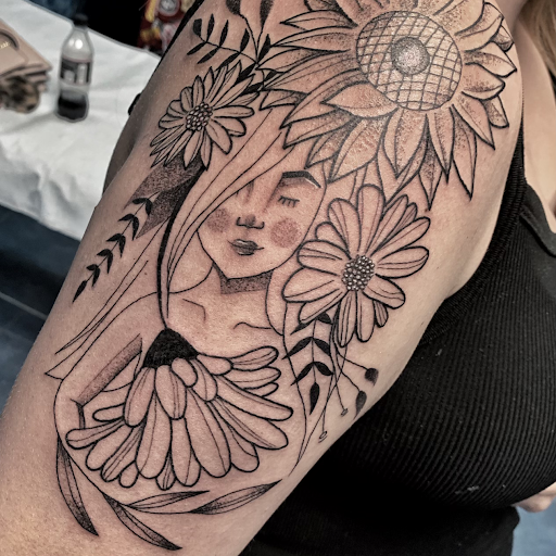 Explore ripped skin tattoo ideas, creative tattoo ideas in Aurora, available at Ronin Tattoo Studio INC