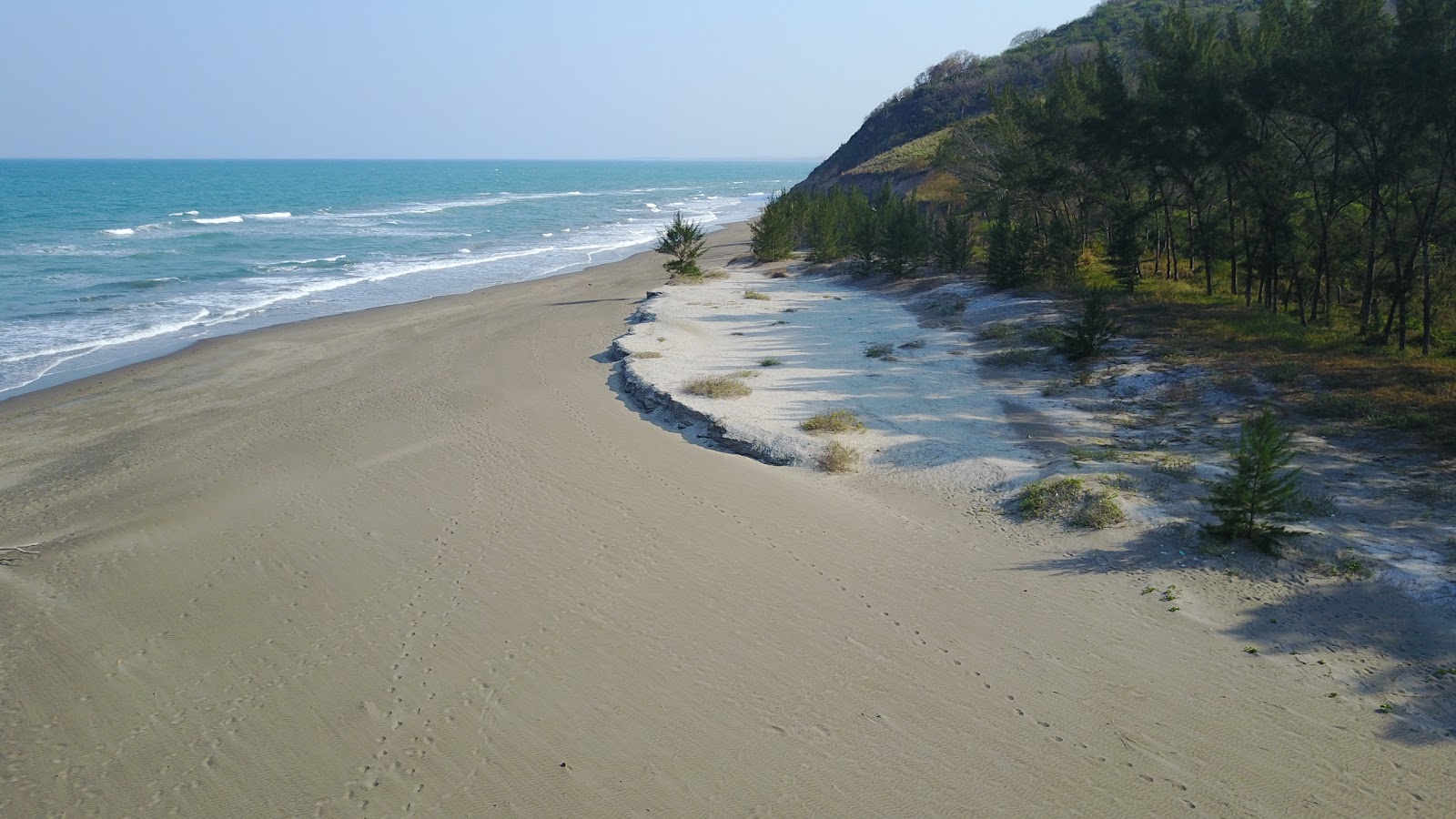 Foto av Playa La Mancha och bosättningen