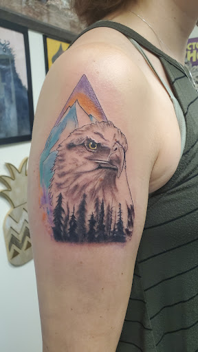 Explore tiger lily tattoo ideas, creative tattoo ideas in Saint Paul, available at Iron Rhino Tattoo