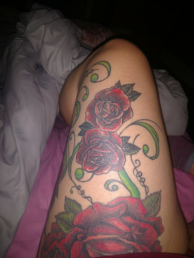 Explore front thigh tattoo ideas, creative tattoo ideas in Owosso, available at Expressions Body Art Studio
