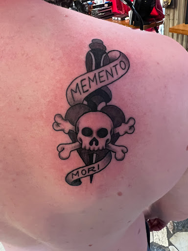 Explore cupid tattoo ideas, creative tattoo ideas in New Orleans, available at Downtown Tattoos and Piercing