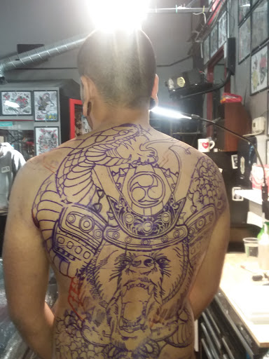 Find small tattoo between breast ideas for your next unique tattoo in Bakersfield at Naked Als Tattoos & Piercing