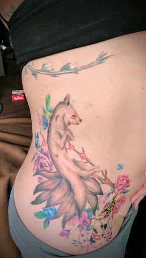 Explore protector tattoo ideas, creative tattoo ideas in Omaha, available at Liquid Courage Tattoos