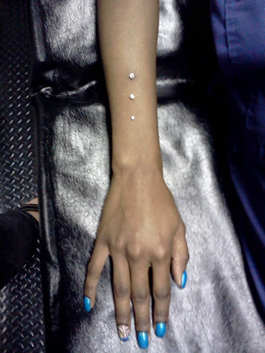 Find bracelet tattoo ideas for females for your next unique tattoo in Summerville at Exotic Impressions Body Piercing