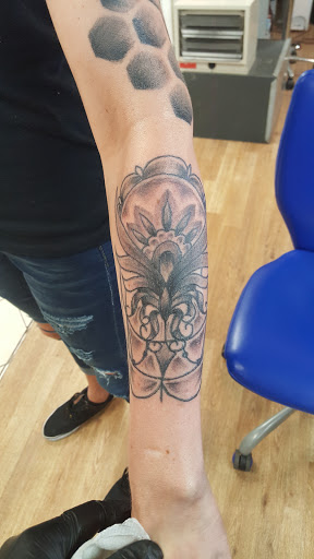 Find alpha and omega tattoo ideas for your next unique tattoo in Marion at Eternal Art Tattooing