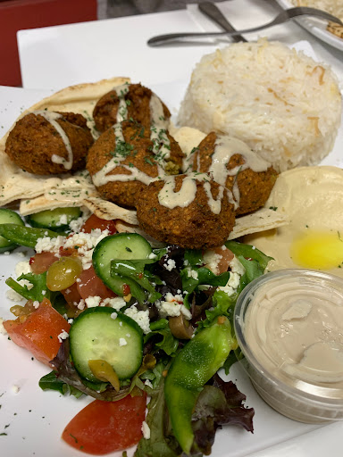 Falafel plate with salad, rice, and hummus