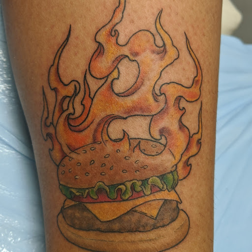 Explore boxer dog tattoo ideas, creative tattoo ideas in Tewksbury, available at Lucid Arts Tattoo Studio