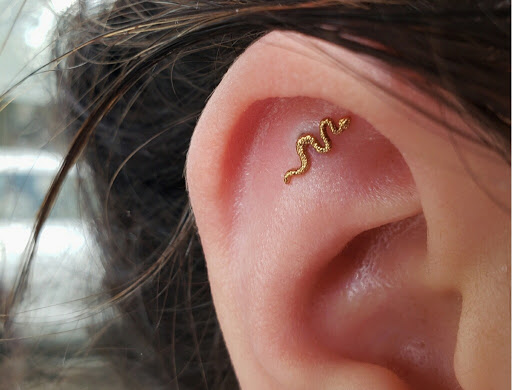 Explore rose foot tattoo ideas, creative tattoo ideas in Atlanta, available at Virtue and Vice Body Piercing